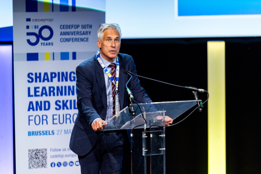 A person standing at a podium