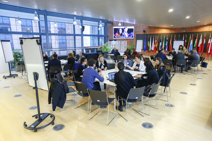 People discussing around tables