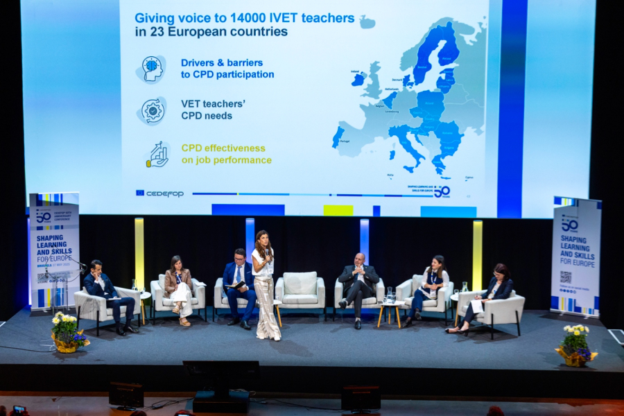A group of people sitting on a stage