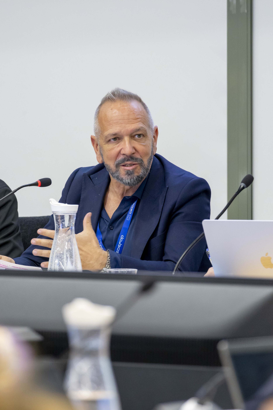 Man speaking from a panel