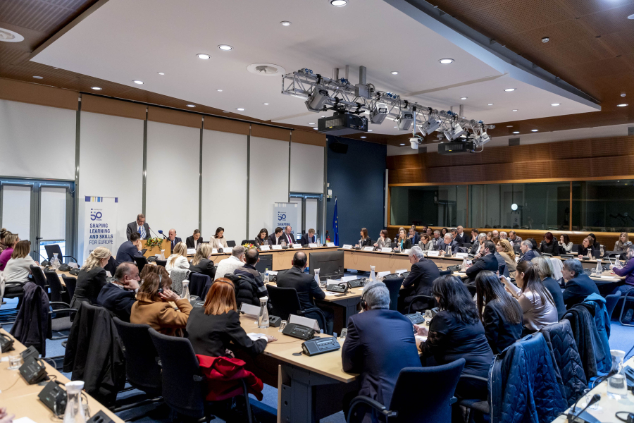 A group of people sitting in a conference room