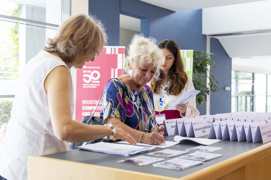 Women signing papers