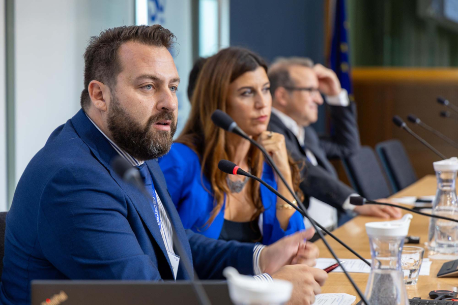 Man speaking from a panel