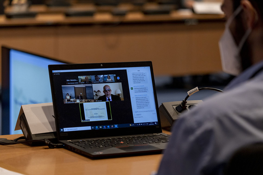 Participants interacting with online guests at the 4th policy learning forum on learning outcomes