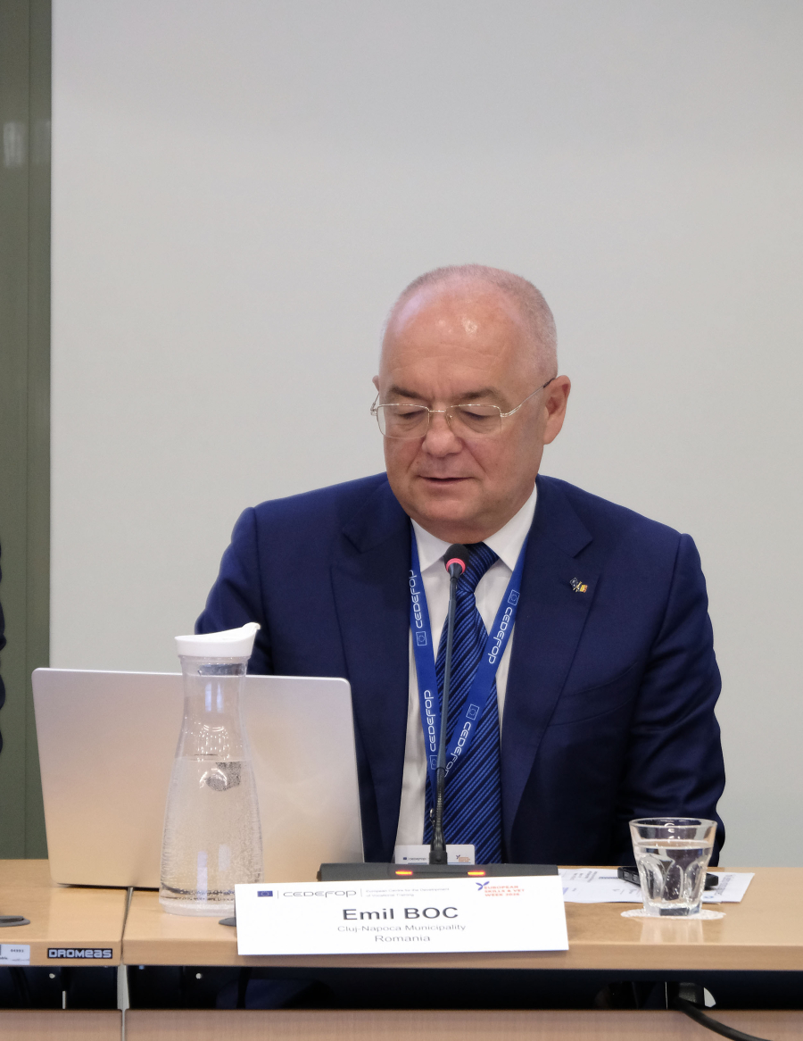 Man speaking in a conference from a panel