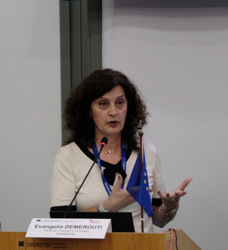 Woman speaking from a podium