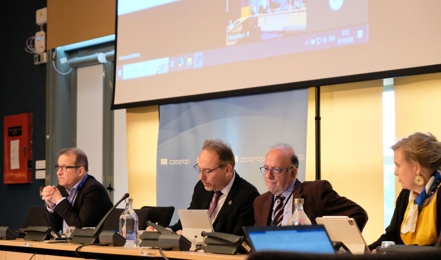 Panel with speakers, 3 men and a woman