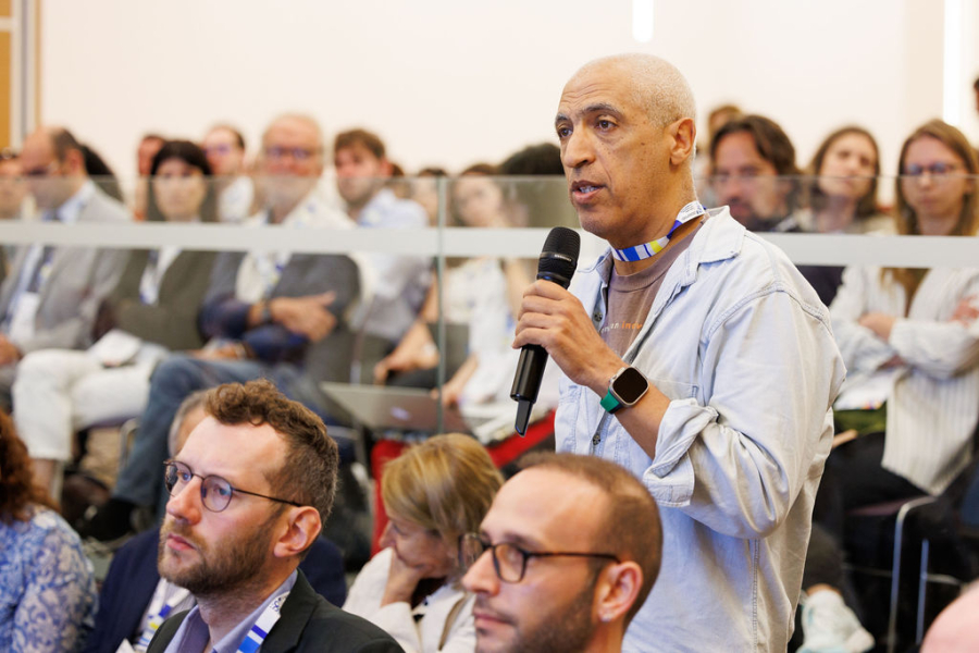 Man asking question in a conference room