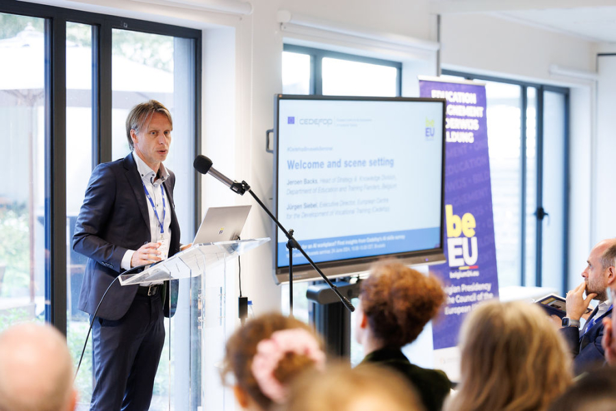 A person standing at a podium giving a presentation